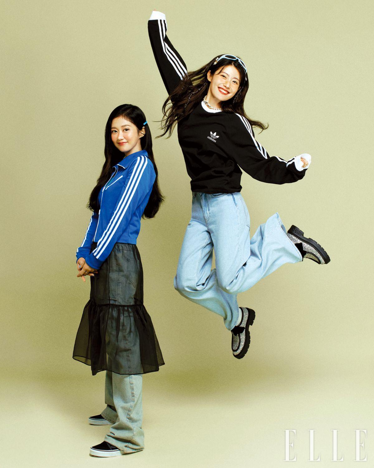 장나라가 입은 트랙 톱은 Adidas. 이너 웨어 톱은 Green Butter. 스커트는 Dew E Dew E. 팬츠는 YCH, 슈즈는 Vans. 하트 체인 네크리스는 Engbrox. 진주 네크리스와 이어 커프는 모두 스타일리스트 소장품. 남지현이 입은 스포티한 블랙 맨투맨 티셔츠는 Adidas. 와이드 데님 팬츠는 Maje. 진주 네크리스는 Vivienne Westwood. 카피바라 참과 하트 참으로 장식한 블루 선글라스는 Gentle Monster. 글리터 로퍼는 Jimmy Choo.