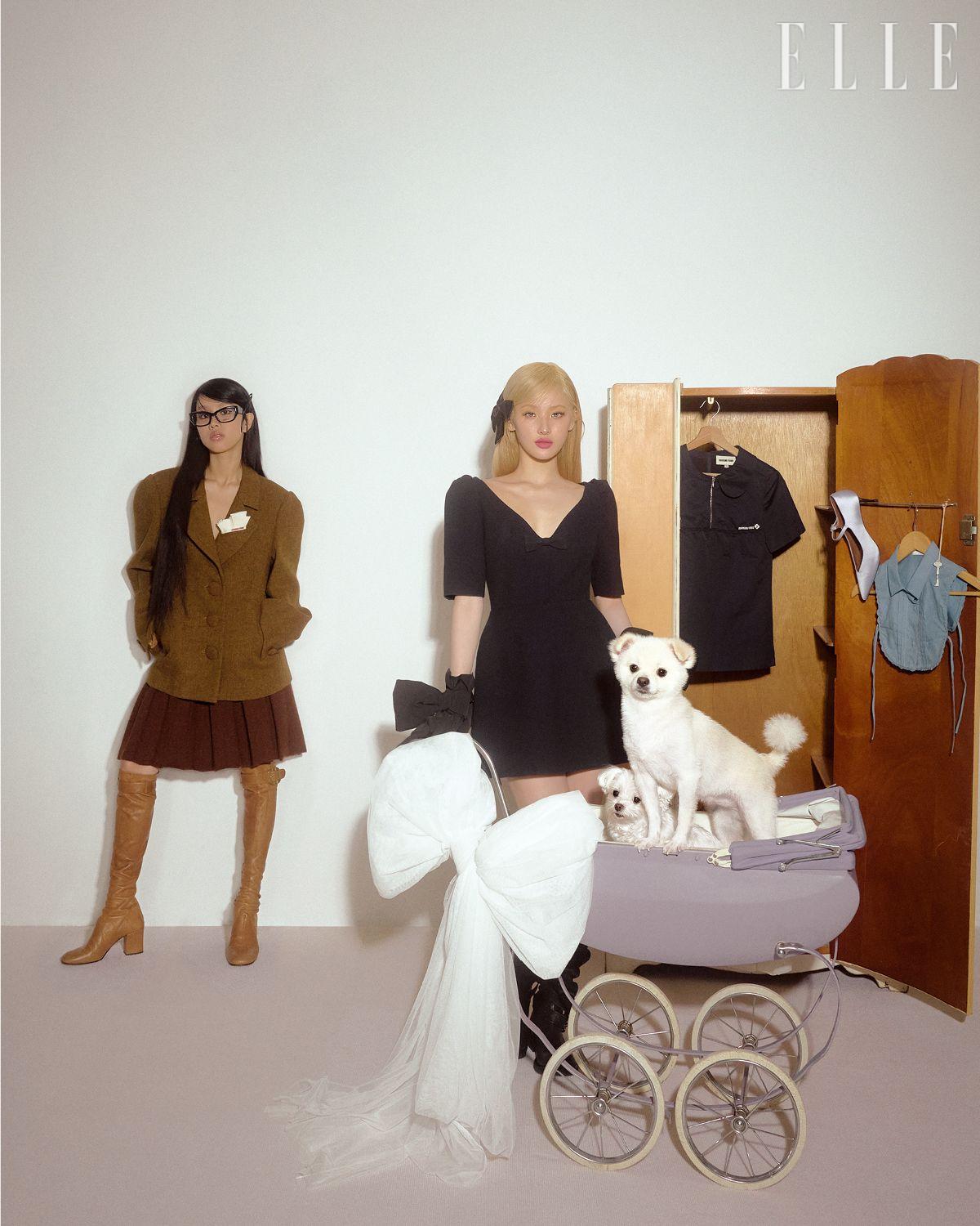 나띠가 입은 행커치프 모티프의 브라운 재킷과 플리츠스커트는 모두 Shushu/Tong. 브라운 부츠는 Miu Miu. 안경은 Balenciaga by Kering Eyewear. 보 헤어핀은 스타일리스트 소장품. 벨이 입은 보 장식 브이넥 미디드레스는 Shushu/Tong. 블랙 부츠는 S/E/O. 보 장식 글러브는 에디터 소장품. 보 헤어핀은 스타일리스트 소장품. 옷장에 걸린 네이비 톱과 슈즈, 페이크 칼라 셔츠는 모두 Shushu/Tong.