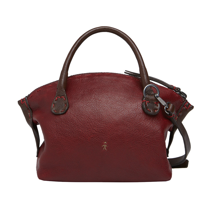 아치 형태가 눈길을 끄는 와인 컬러의 숄더 스트랩 백은 1백5만원, Henry Beguelin.