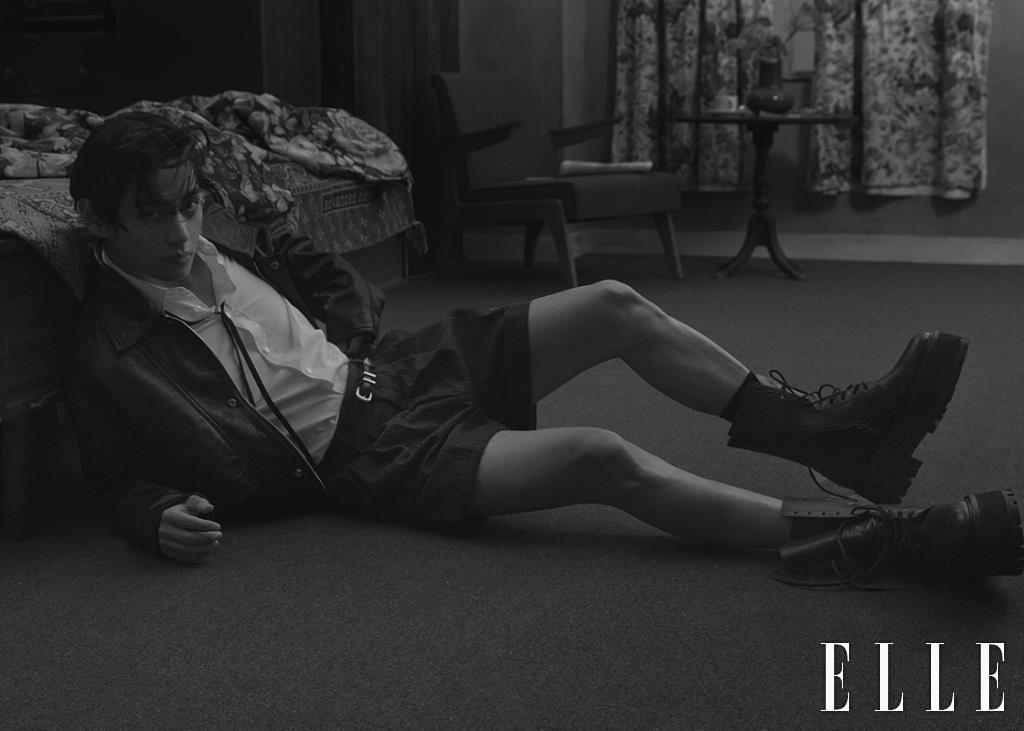 Black Leather Jacket with White Shirt, Narrow Tie, Shorts, Belt, and Black Worker Boots are all from Celine Homme.