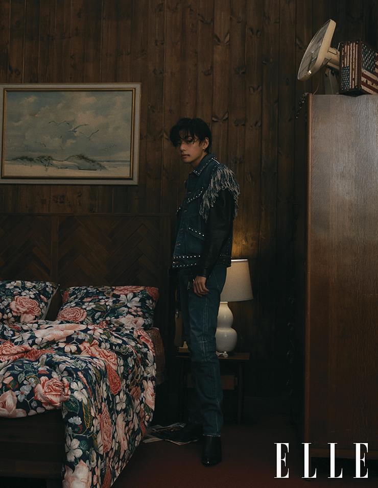 Denim Vest with Studs and Fringes layered with Black Leather Jacket, Wash Denim Pants, and Ankle Boots are all from Celine Homme.
