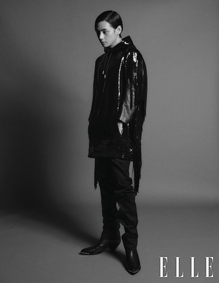 Spangled Hooded Knit Top with Fringes layered with a Leather Jacket, Black Denim Pants, Chelsea Boots with Metal Details are all from Celine Homme.