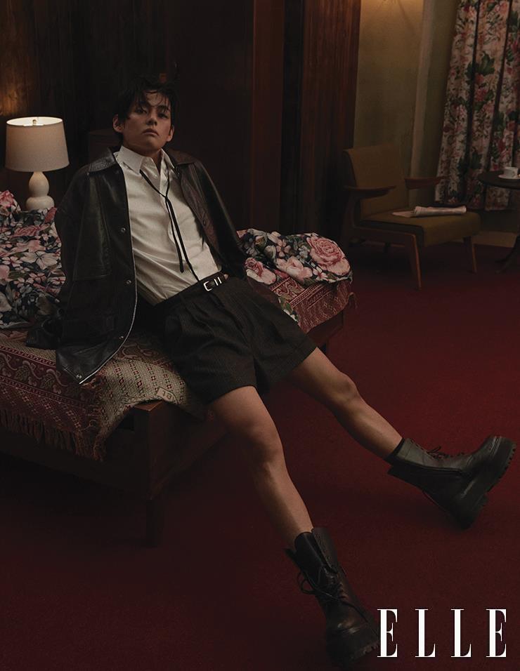 Black Leather Jacket with White Shirt, Narrow Tie, Shorts, Belt, and Black Worker Boots are all from Celine Homme.