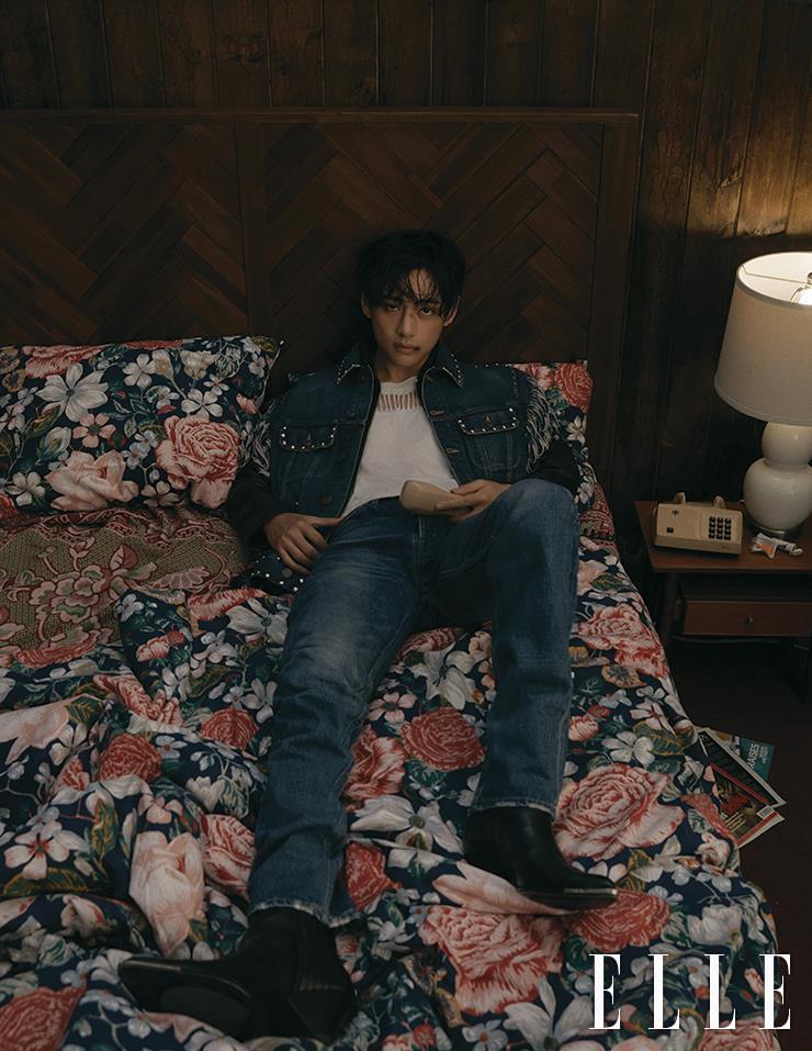 Sleeveless Denim Trucker Jacket with Studs and Fringes, Black Leather Jacket, White Top and Wash Denim Pants, and Chelsea Boots are all from Celine Homme.